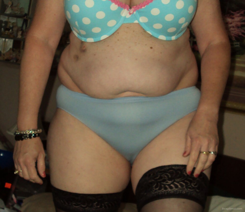 My plump milf wife strips for pics and poses