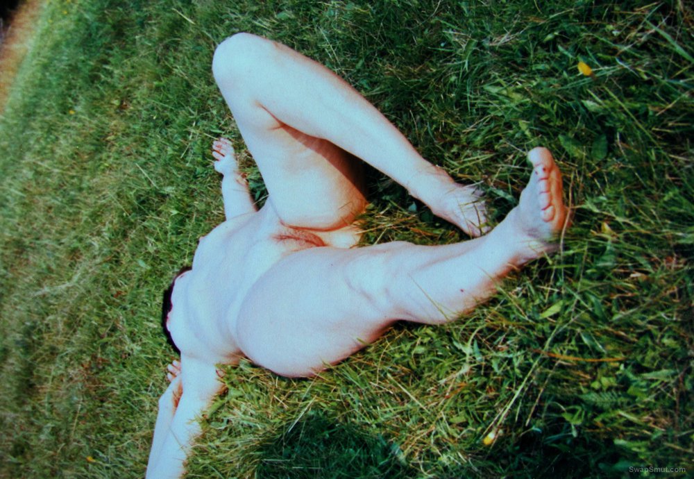 Mature slut wife sunbathing outside naked on the grass