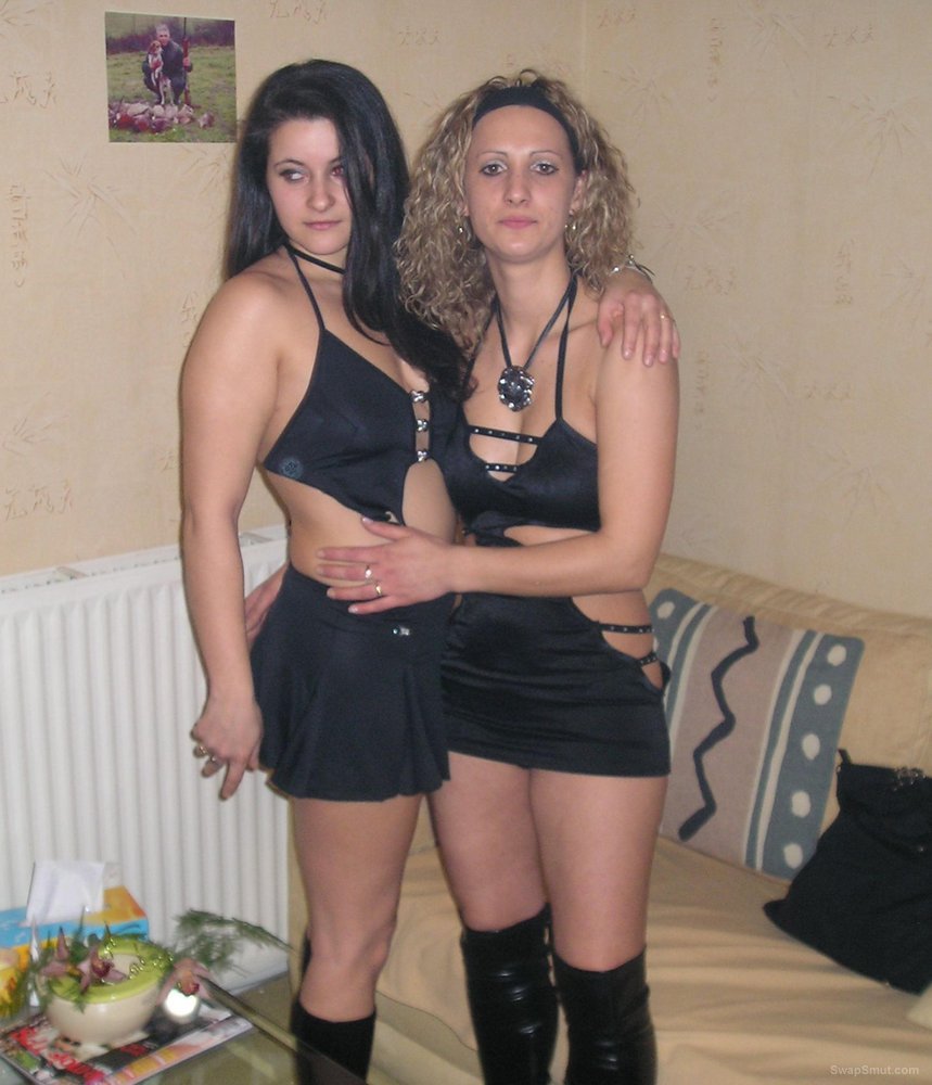 A very sexy wife posing at home with her slutty friends image