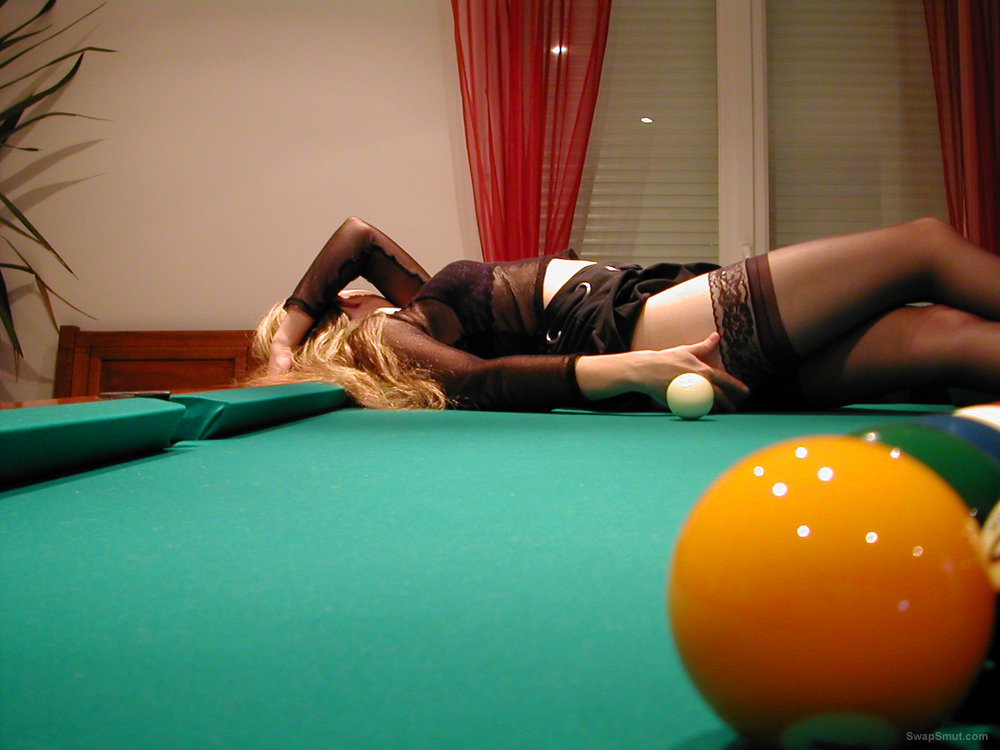 A slutty swinger wife having adult fun on a pool tale with sex toys