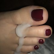 My wife’s sexy cum covered toes