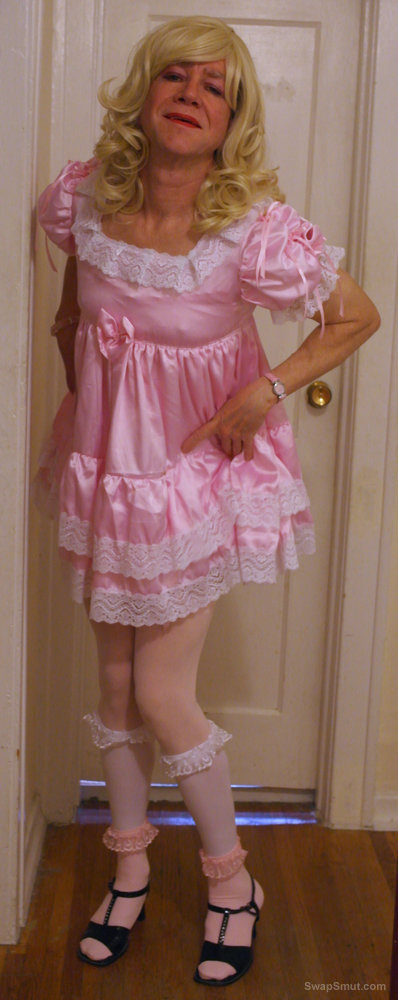 Shirley's sissy photos lifting up frilly dress to reveal chastity cock
