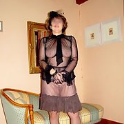 Mature French housewife posing around the house in her black lingerie