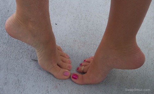 A few of my toes and a few of my sexy friend's little piggie's