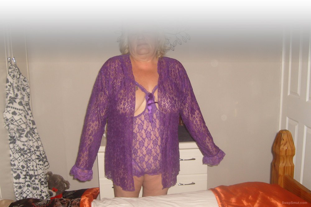 My wife sandy posing and playing in her sexy purple teddy cover her in spunk she loves it