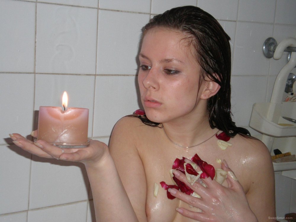 Return of petite brunette who takes a bath with flowers