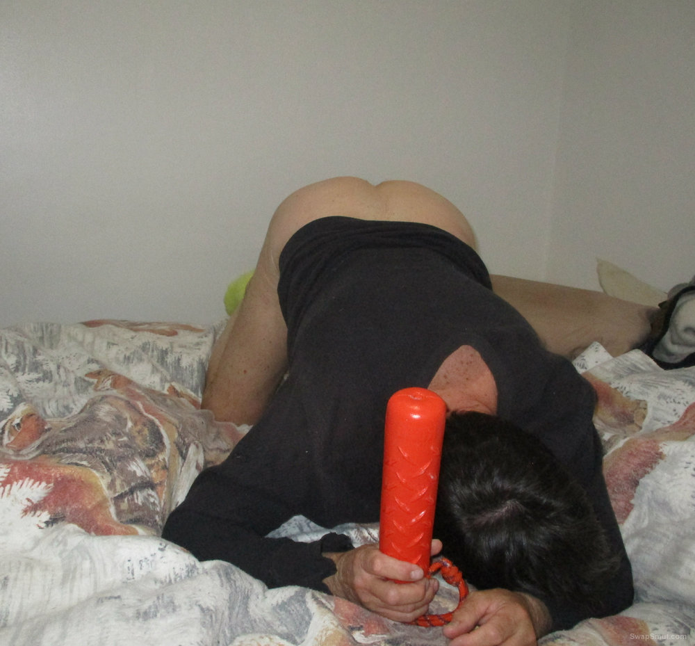 Playing with my ass toy on my bed in michigan
