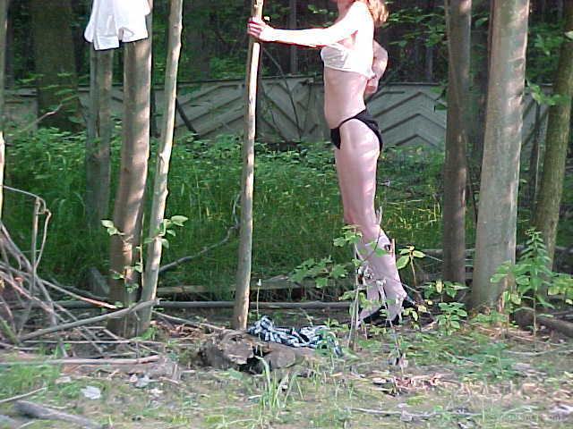 Sexy woman stripping in the woods getting completely naked
