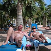 Nudist couple sharing some of thier holiday snaps naked outdoors