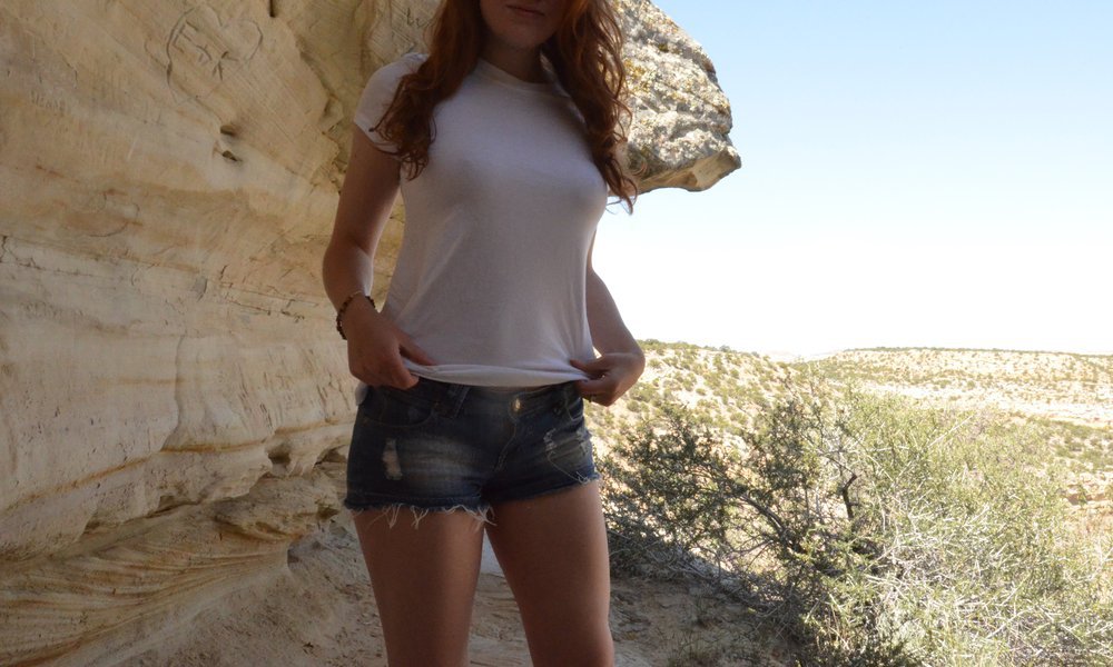 Foxy redhead stripping down in the mountains