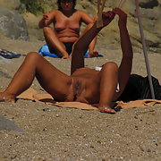 Amazing granny tanning her hairy cunt at the public beach