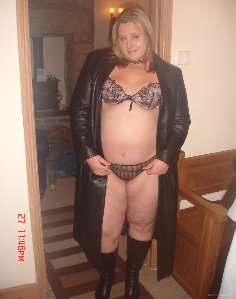 Chubby wife posing in some bdsm gear revealing curvaceous body